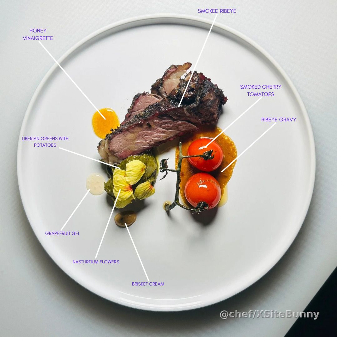 A dish crafted for the one who never showed. Smoked ribeye served with Liberian greens and potatoes, smoked cherry tomatoes, ribeye gravy, grapefruit gel, brisket cream, and a kiss of honey vinaigrette—finished with nasturtium flowers for what could’ve bloomed.

Flavors that speak louder than words. You missed the dinner, but not the inspiration.

#ChefDweh #MissedOpportunity #FoodWithFeeling #FineDining #CulinaryStorytelling #PlatedEmotions #FromTheHeart #FlavorAndFeeling