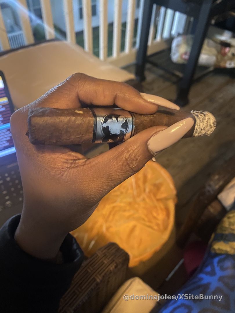 On the balcony with my cigar, enjoying Friday night!