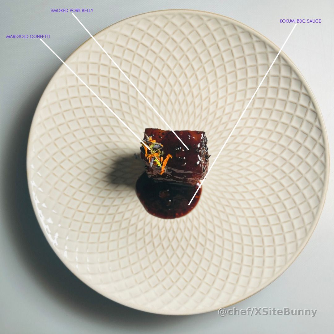 Big flavor in a small, powerful bite.

This smoked pork belly is glazed in my signature kokumi BBQ sauce and finished with marigold confetti for a burst of color and floral lift. Deep, rich, tender, and unapologetically bold—this dish proves simplicity can still command the spotlight.